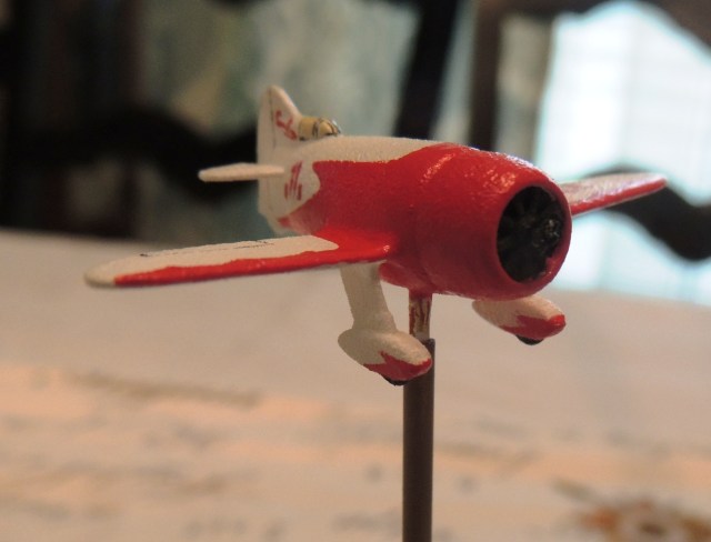 This miniature has a fuselage length of about 1 5/8" and the wingspan is about 2"