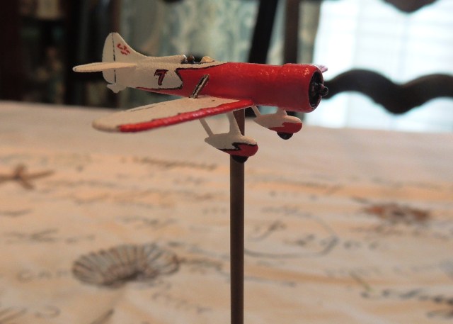 The fuselage length of this miniature is about 1 3/4" and the wingspan is nearly 2 1/2".