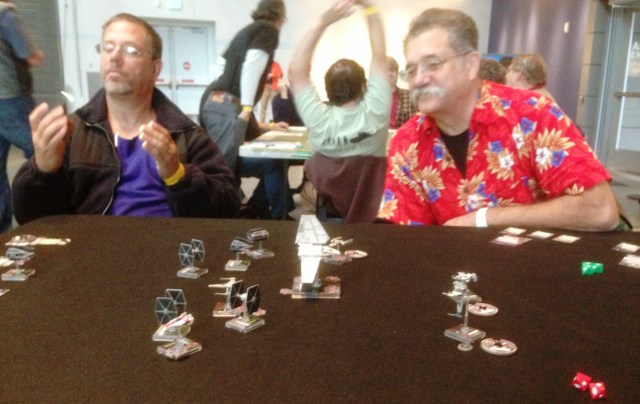 Hugh Sing, right, watches Scott Murphy's X Wing Fighter game. 