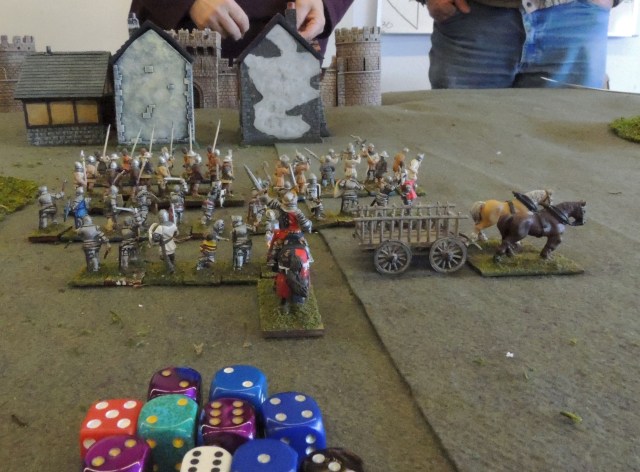 English retinue in the center comprised three units of dismounted men-at arms, two units of expert foot sergeants and a unit of bidowers. Nasty stuff, but they faced supporting fire from the castle.  