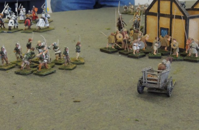 English on the left have burned one of the farm structures, while mounted French advance on them. 