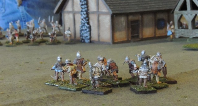 On the French left, a unit of crossbowmen huddle, unsure of what to do against the English