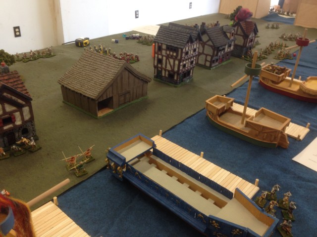 The playtest set-up. The French fleet rests at anchor as English retinues approach from either end of the town. French reinforcements boil out of upper Bolougne and down to the docks 