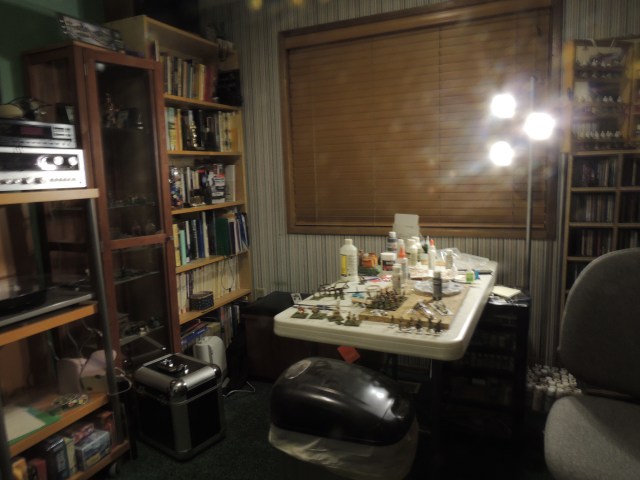 It's hard to tell from this photo, but I've pushed my painting table toward the back of the room and near the window.  It's opened up the space so it's more walkable without interfering with my work space. 