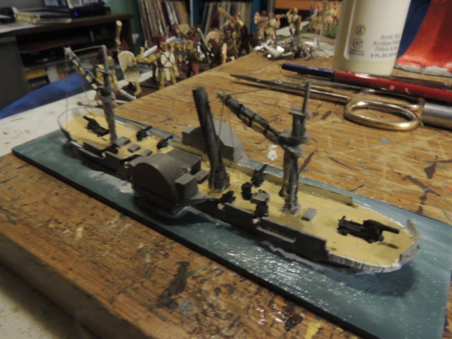 This picture shows the brass wire going up around the two masts. 